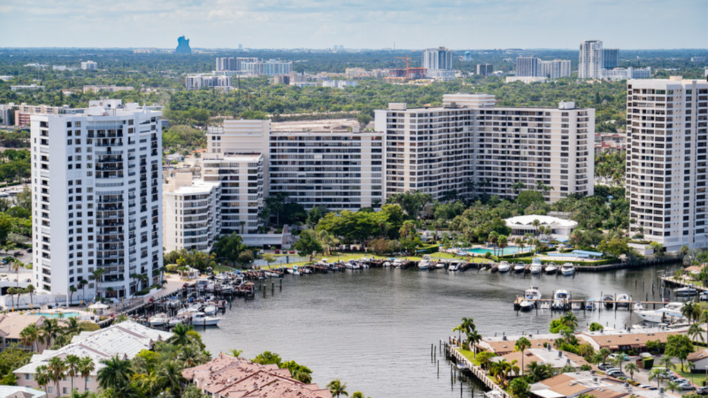 Mid-rise waterfront condominium buildings along a canal in Hollywood, Florida